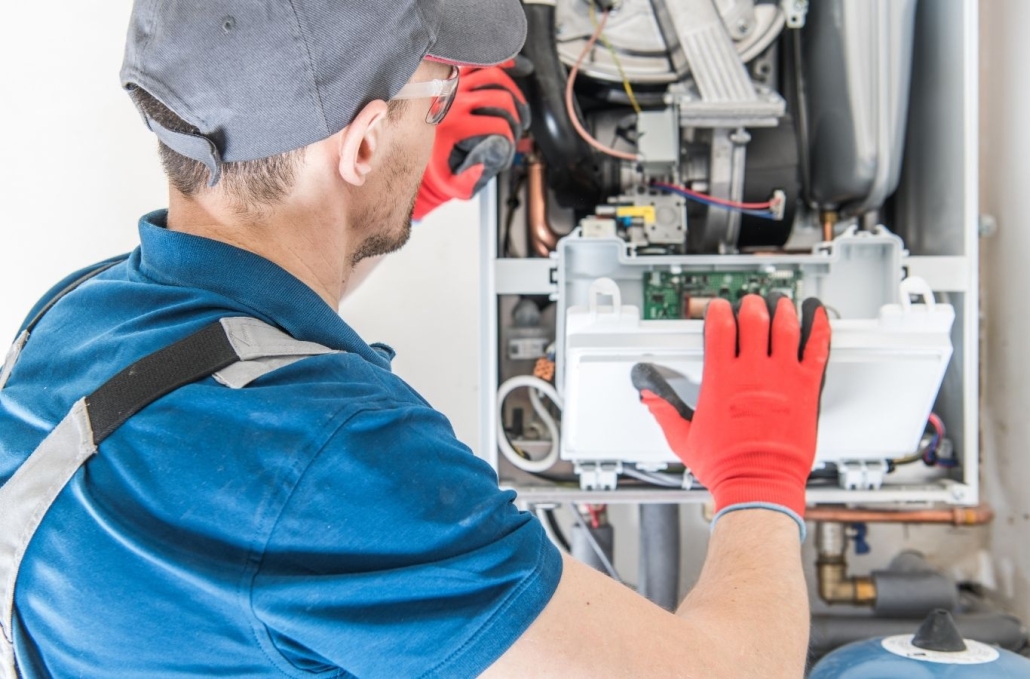 A/C Doctors technician inspecting a heating system in Port St. Lucie, FL ensuring safety, comfort, and efficiency.